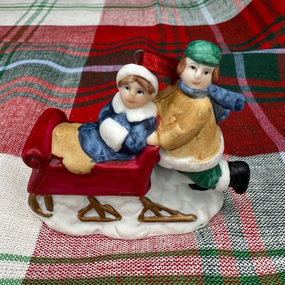 R.O.C. Ceramic Man Pushing Woman In Sled Christmas Village Ornament